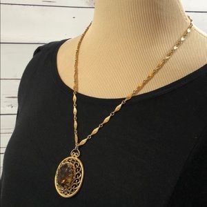 Vintage necklace With amber colored stone